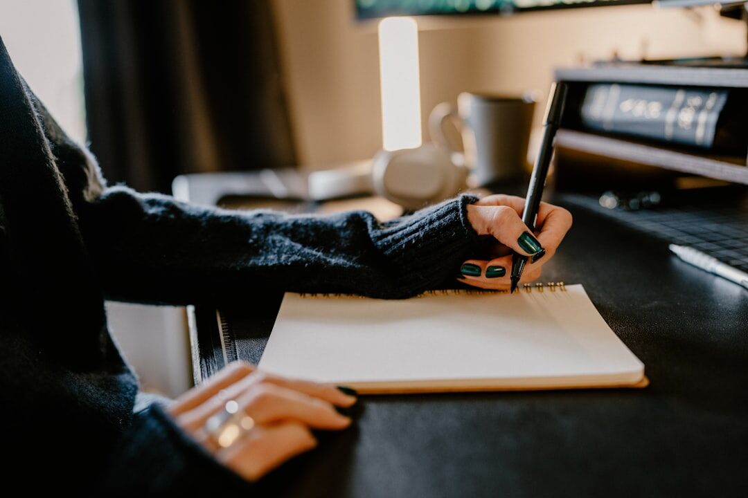 writer at desk with notes